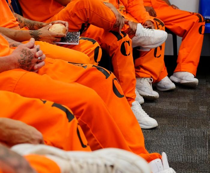 Inmates sitting in an Arizona Department of Corrections meeting