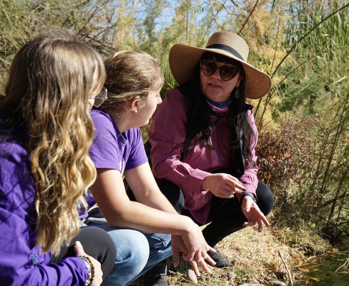 Meghan Smart and GCU students on a riverbank