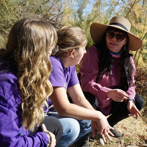 Meghan Smart and GCU students on a riverbank